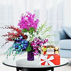 Glass Vase Arrangement of Mixed Color Orchids with Ferrero Rocher