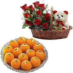 Red Roses, a Teddy Bear in a handle basket & Boondi Laddu Sweets