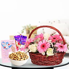 Basket Arrangement of 8 Pink Gerberas and 8 White Roses with Cashew Nuts, Dairy Milk and Greeting Card