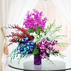 Glass Vase Arrangement of Mixed Color Orchids