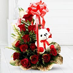 12 Red Roses and 1 teddy in a basket